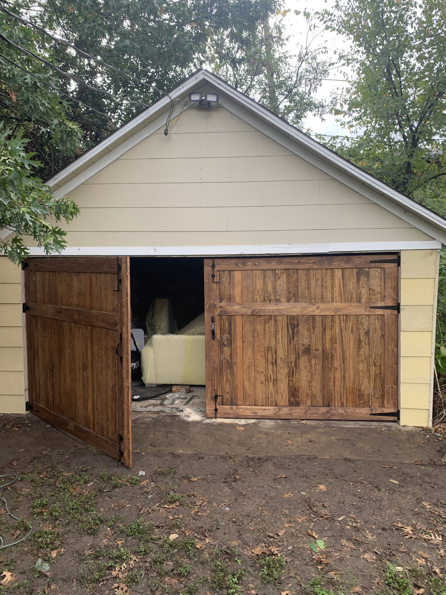 Rustic Flat Panel Barn Door with Wooden Hinges