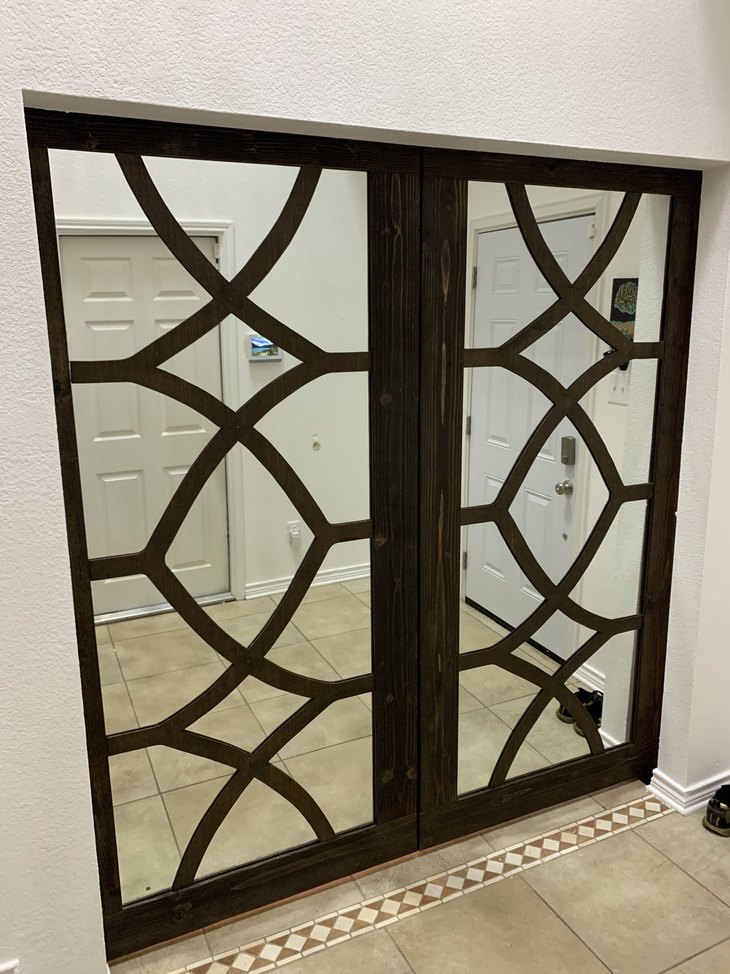 Geometric Pattern Barn Door with Dark Wood Finish