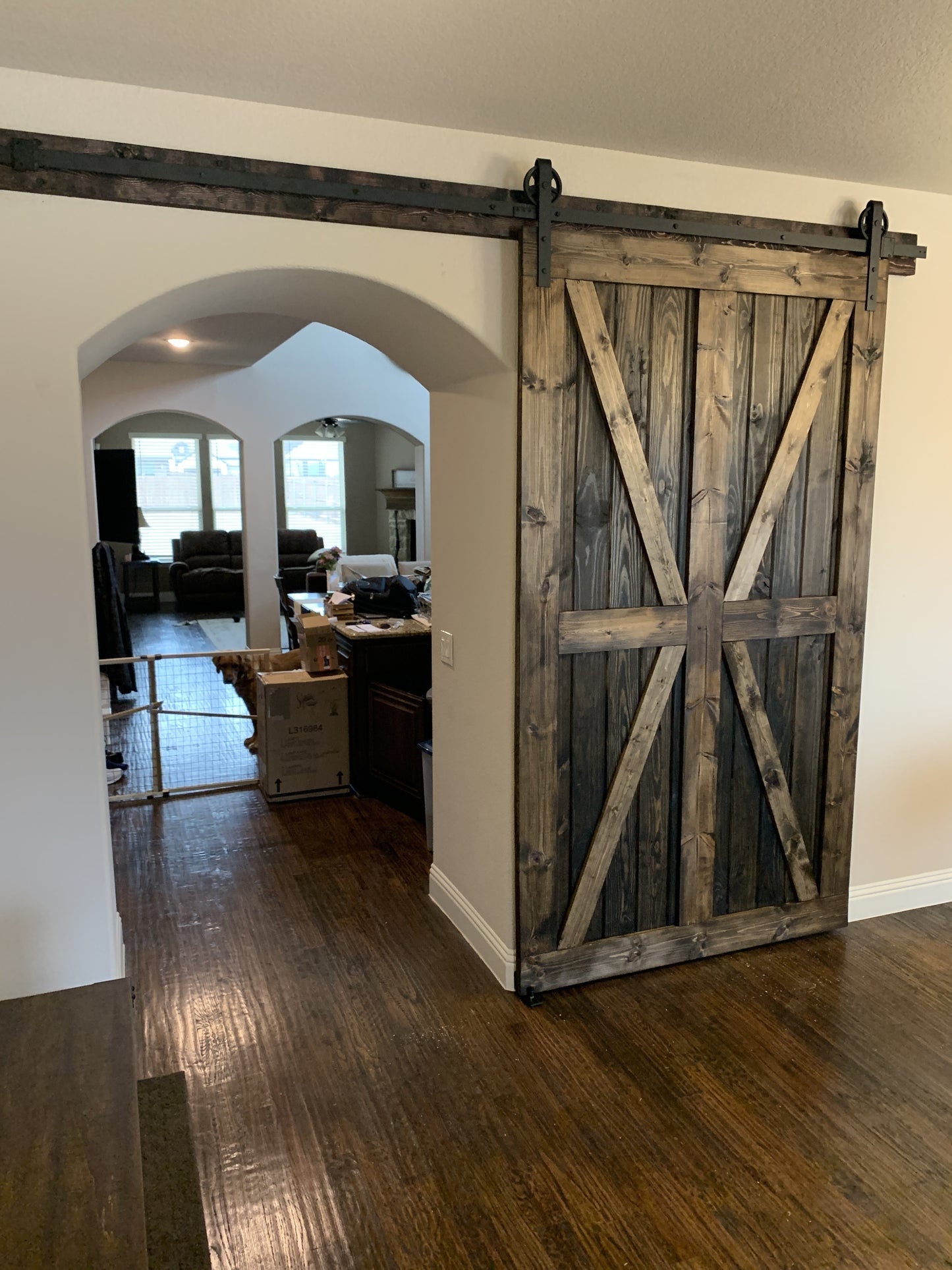 Rustic X-Brace Sliding Barn Door with Iron Hardware