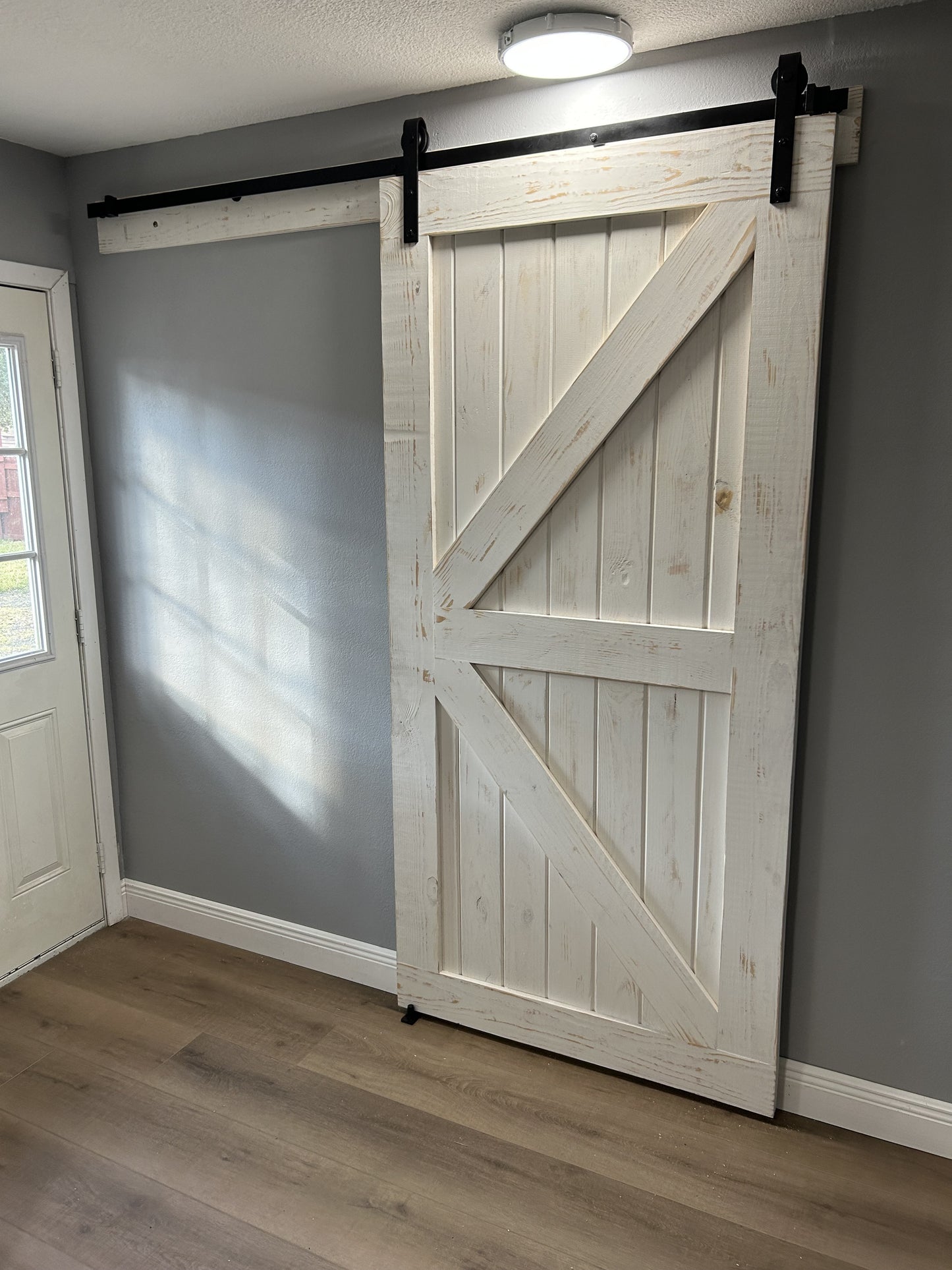Rustic X-Brace Barn Door with Distressed Finish
