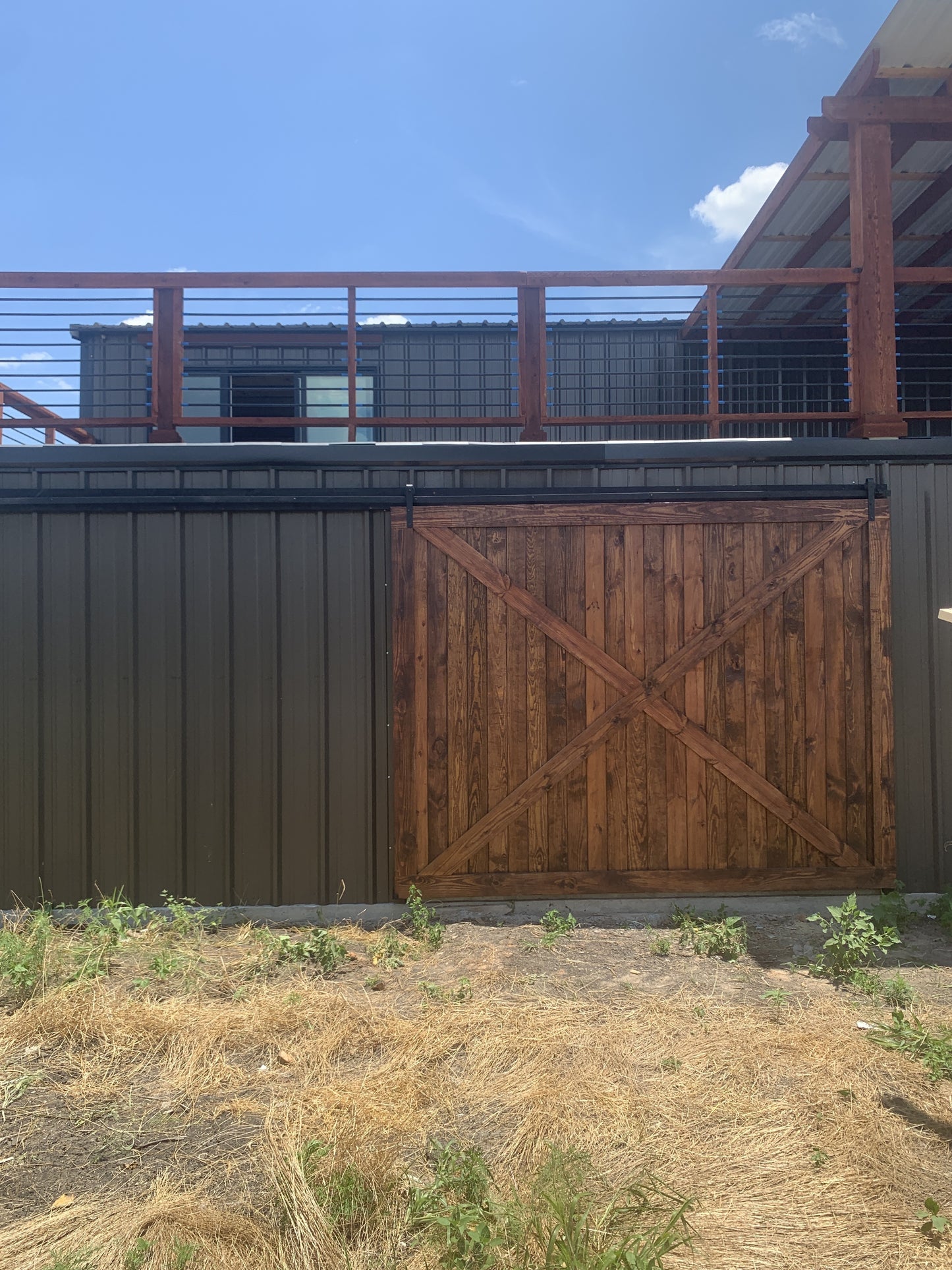 Rustic X-Brace Sliding Barn Door with Wood Finish