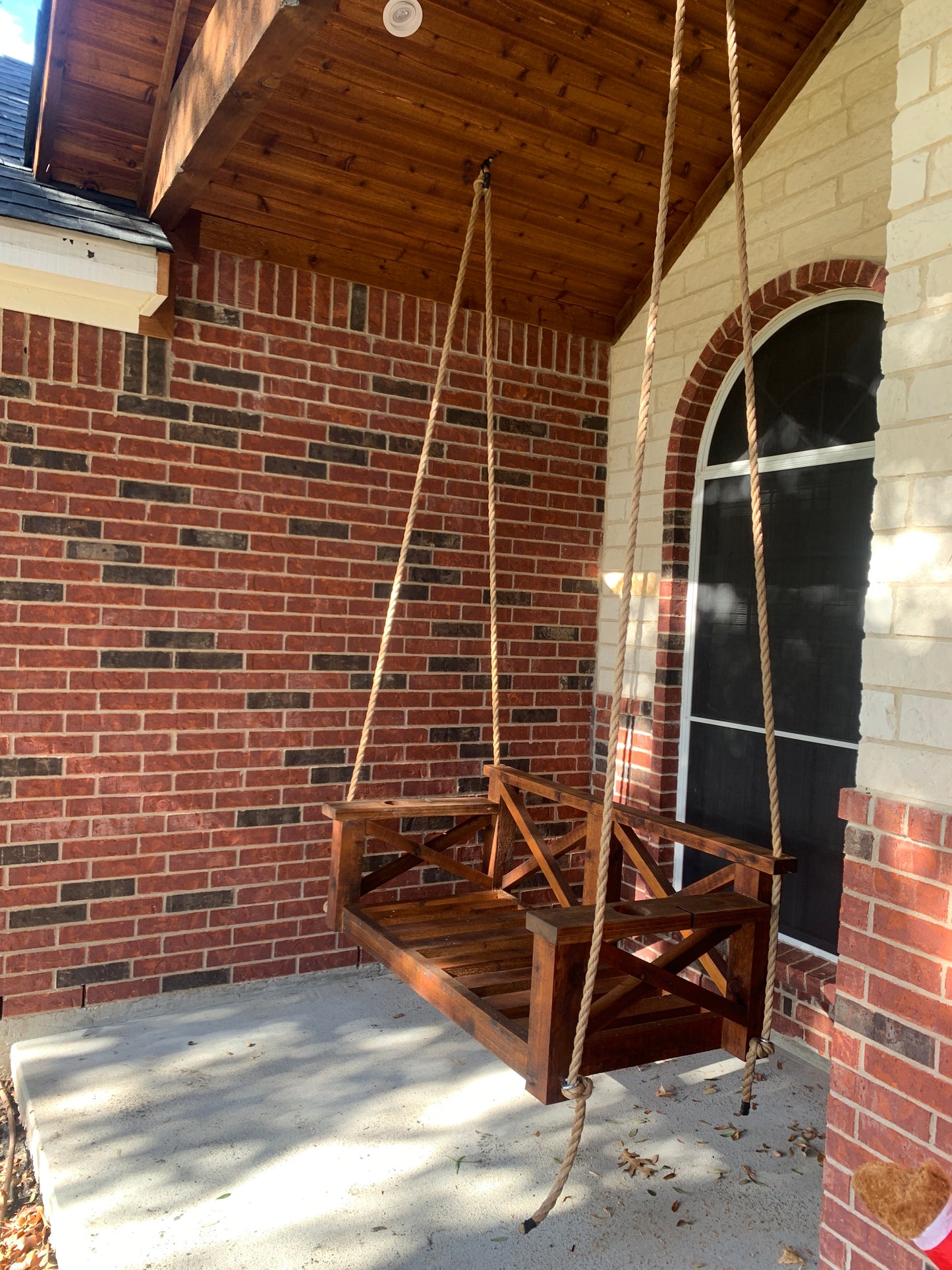 Twin size cedar porch swing bed with natural cedar finish and clear coat
