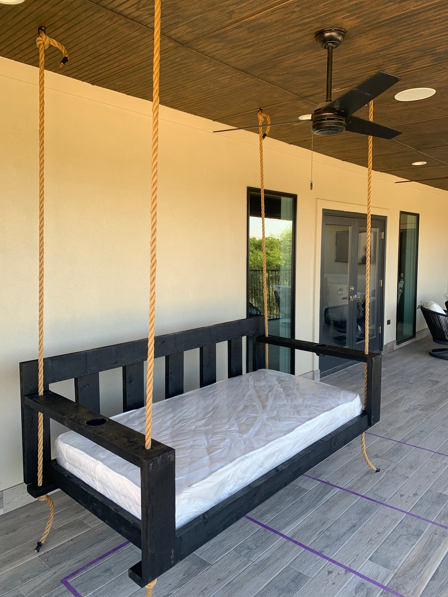 Twin size cedar porch swing bed with natural cedar finish and clear coat