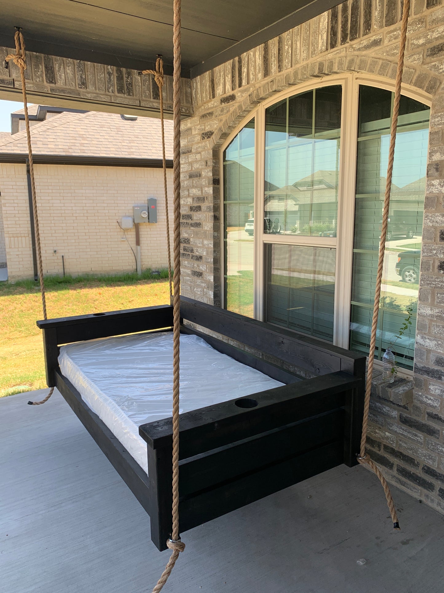 Twin size cedar porch swing bed with natural cedar finish and clear coat