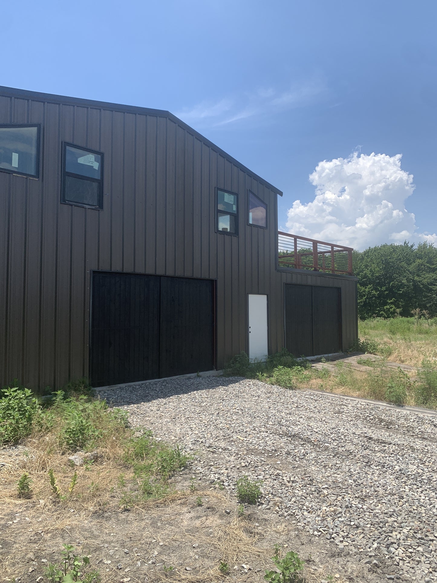 Modern Flat Board Barn Door with Upper Deck Railing