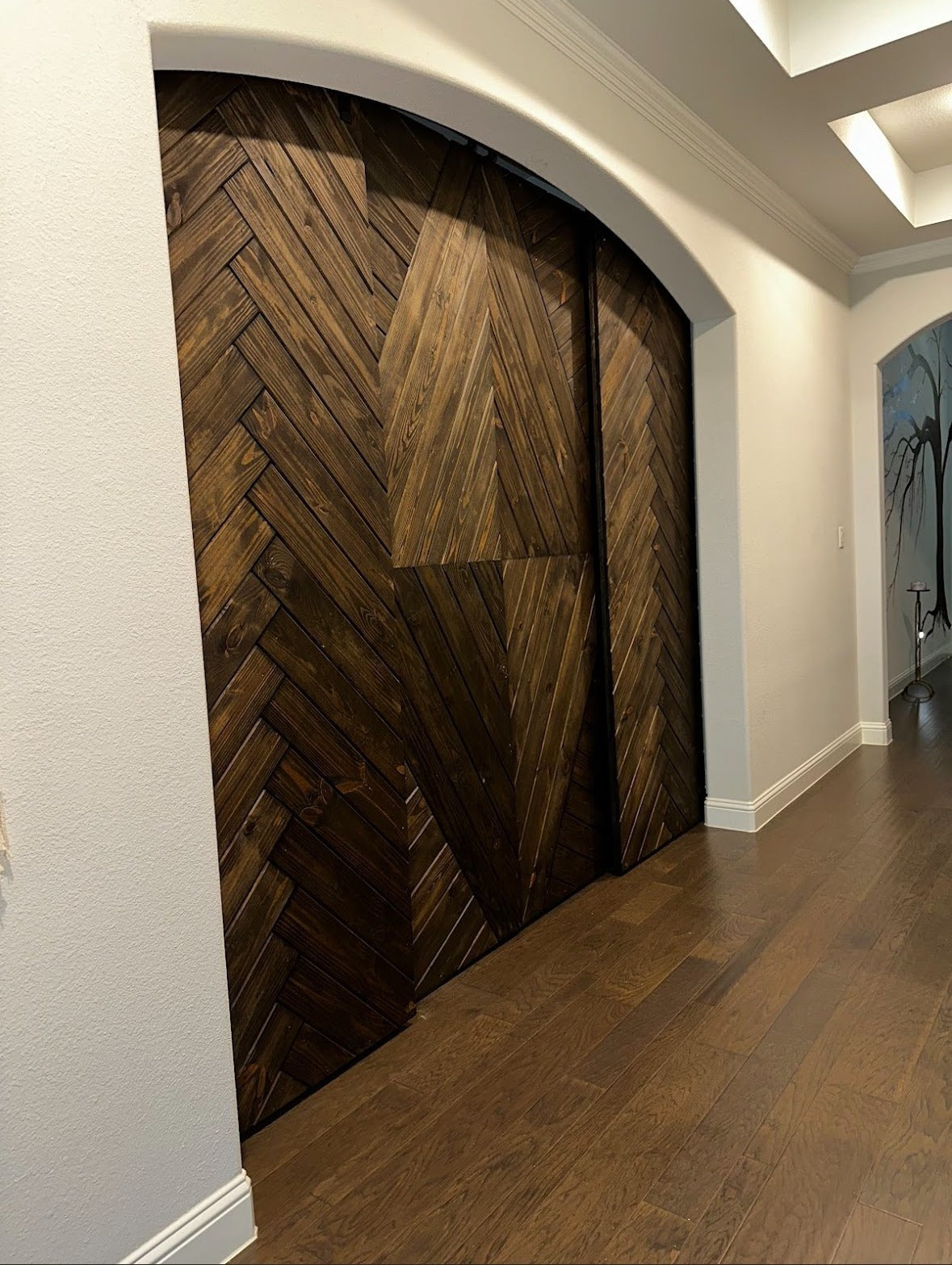 Chevron Pattern Arched Barn Door with Dark Finish