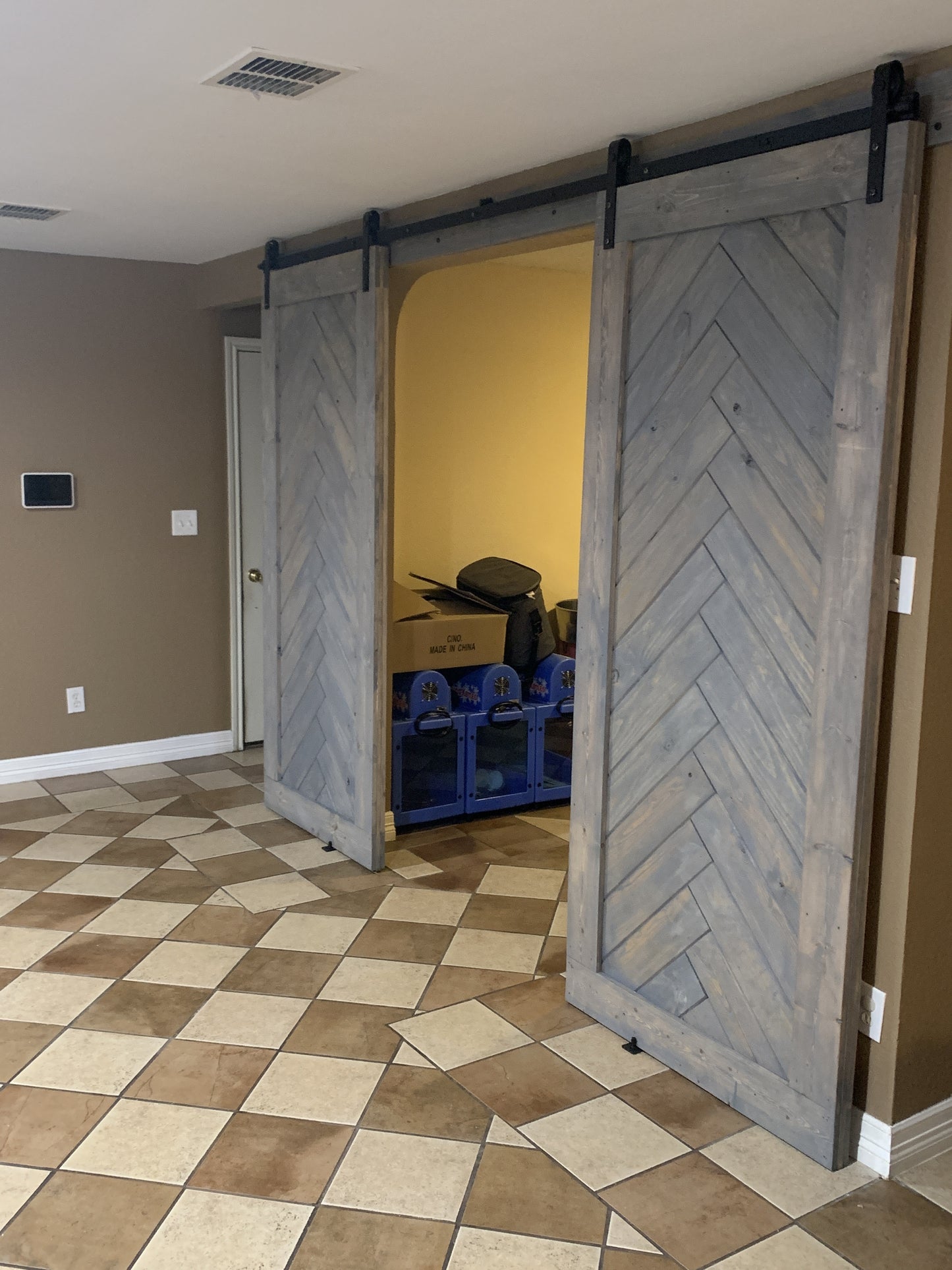 Chevron Pattern Sliding Barn Door with Black Hardware