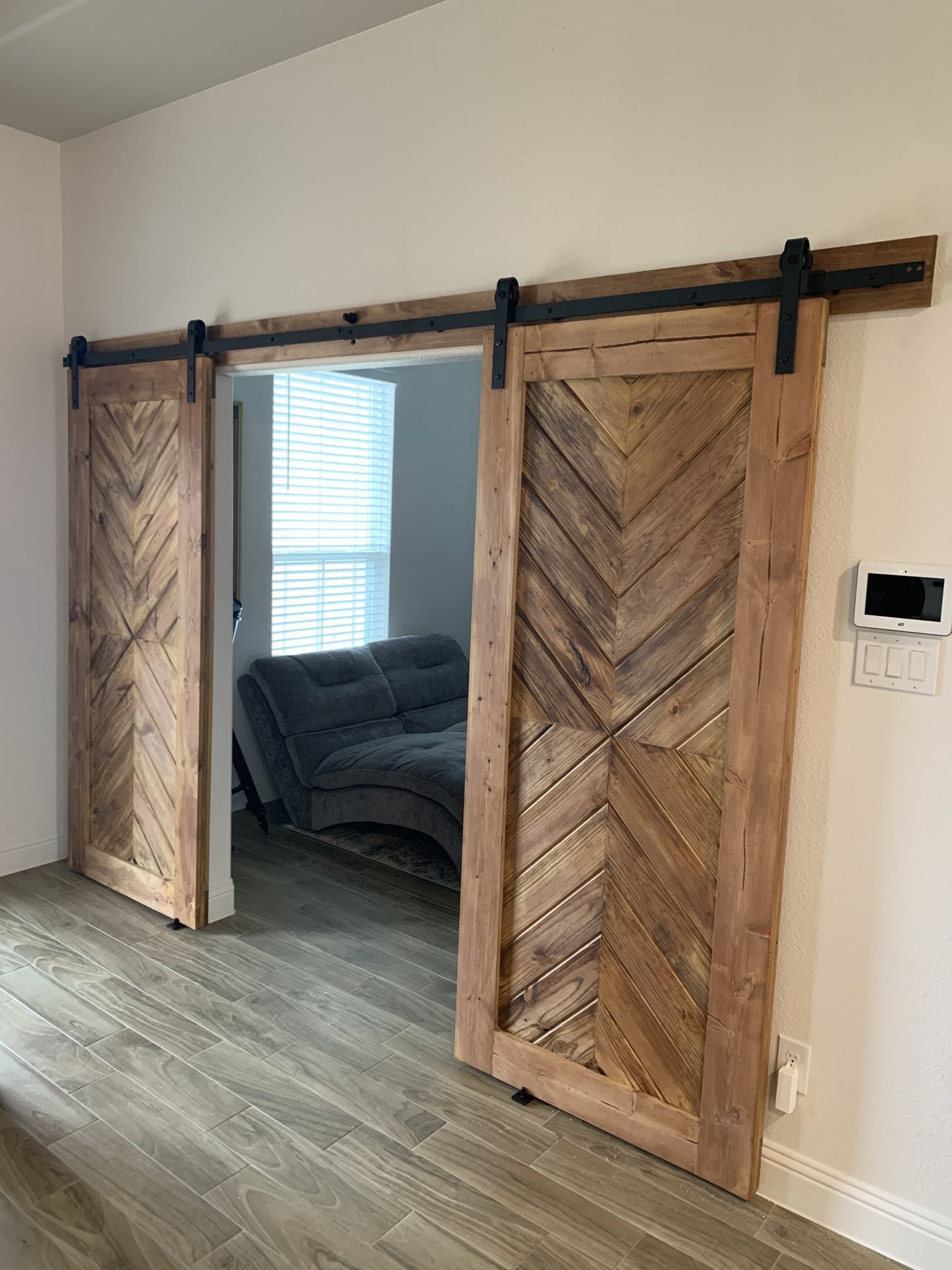 Chevron Pattern Rustic Barn Door with Black Hardware