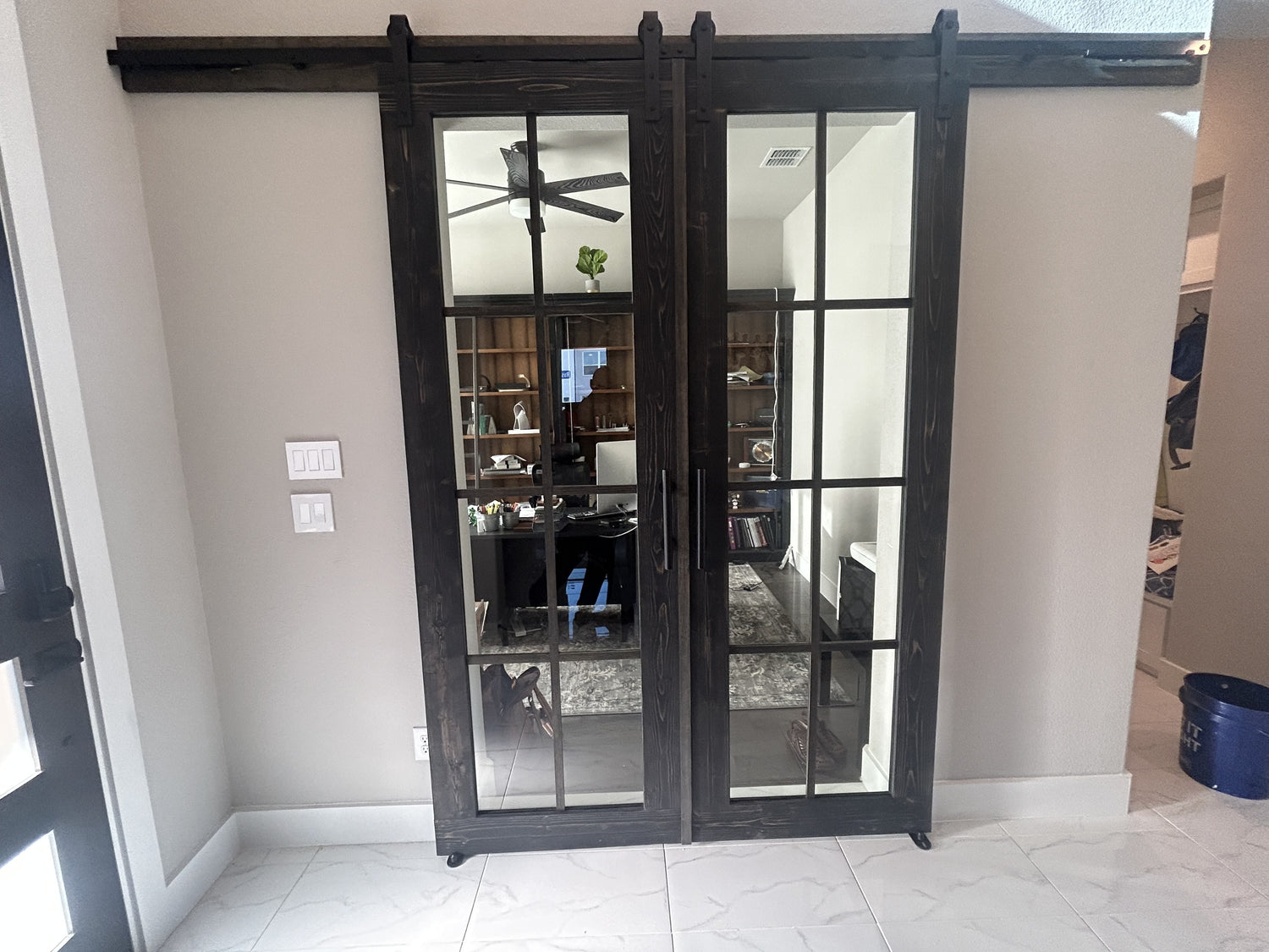 Contemporary Glass Barn Door with Dark Wood Frame