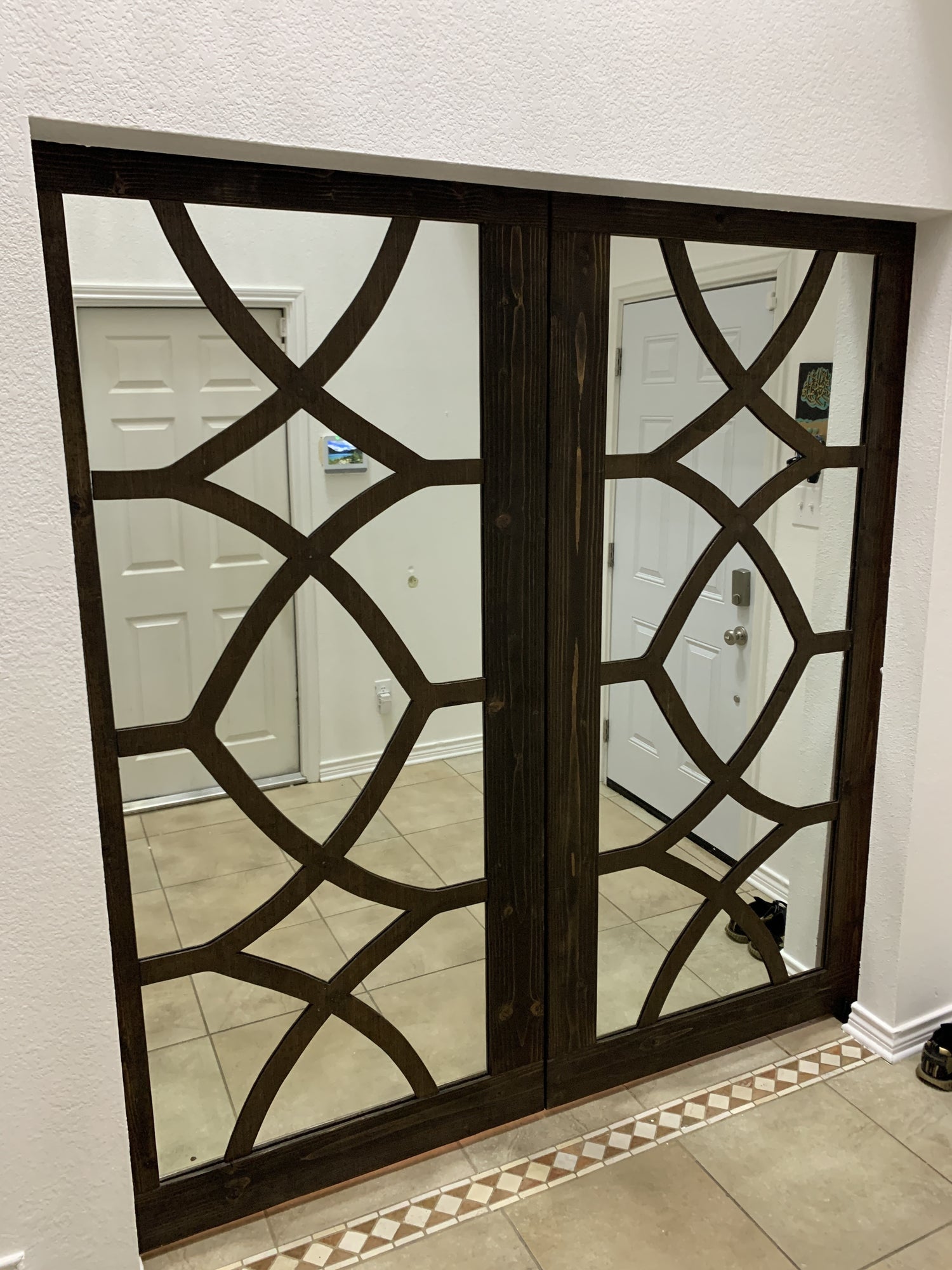Geometric Pattern Barn Door with Dark Wood Finish