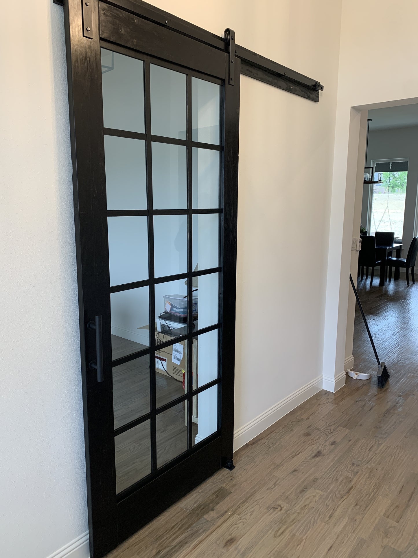 Glass Panel Barn Door with Black Metal Frame