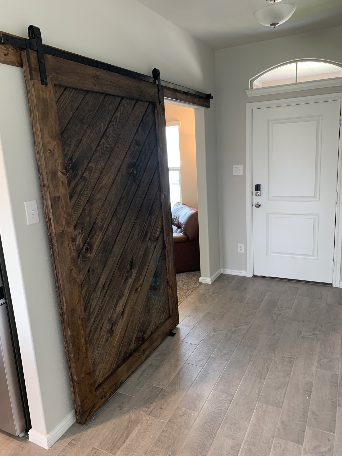 Rustic Diagonal Slat Barn Door with Black Hardware