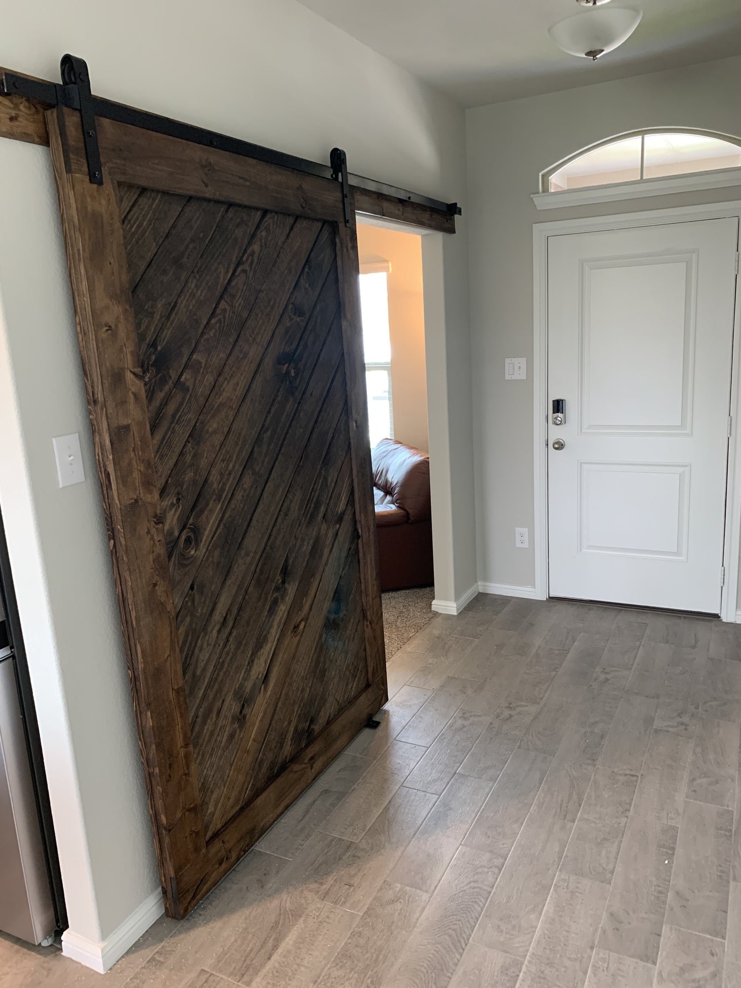 Rustic Diagonal Slat Barn Door with Black Hardware