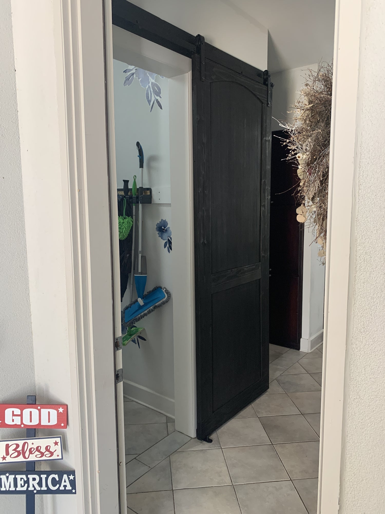 Classic Black Barn Door with Decorative Wreath