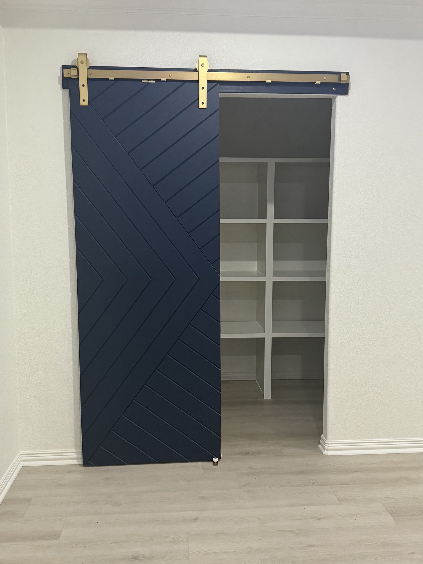 Chevron Design Barn Door with Gold Hardware