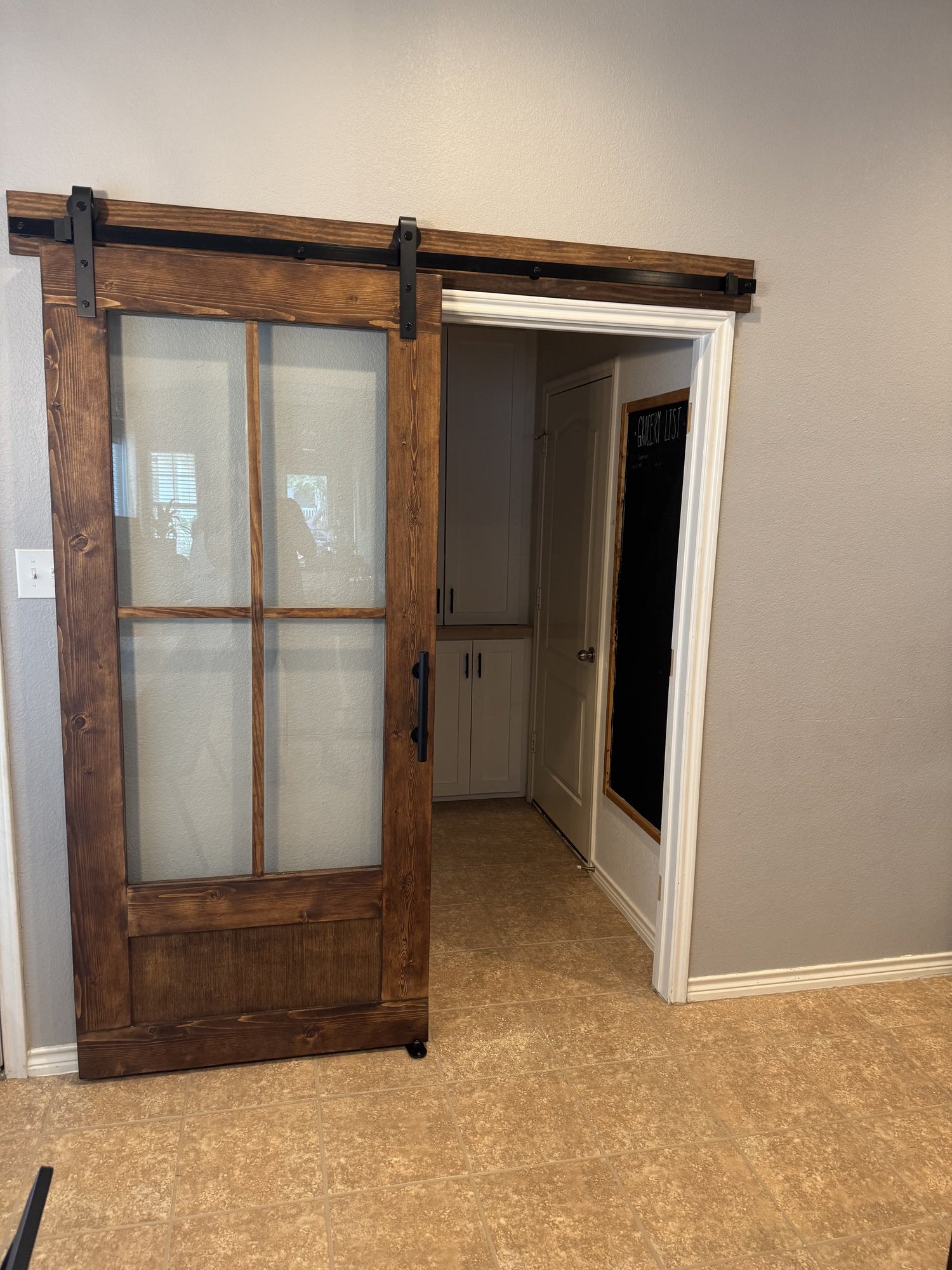 Rustic Barn Door with Glass Panels and Black Hardware
