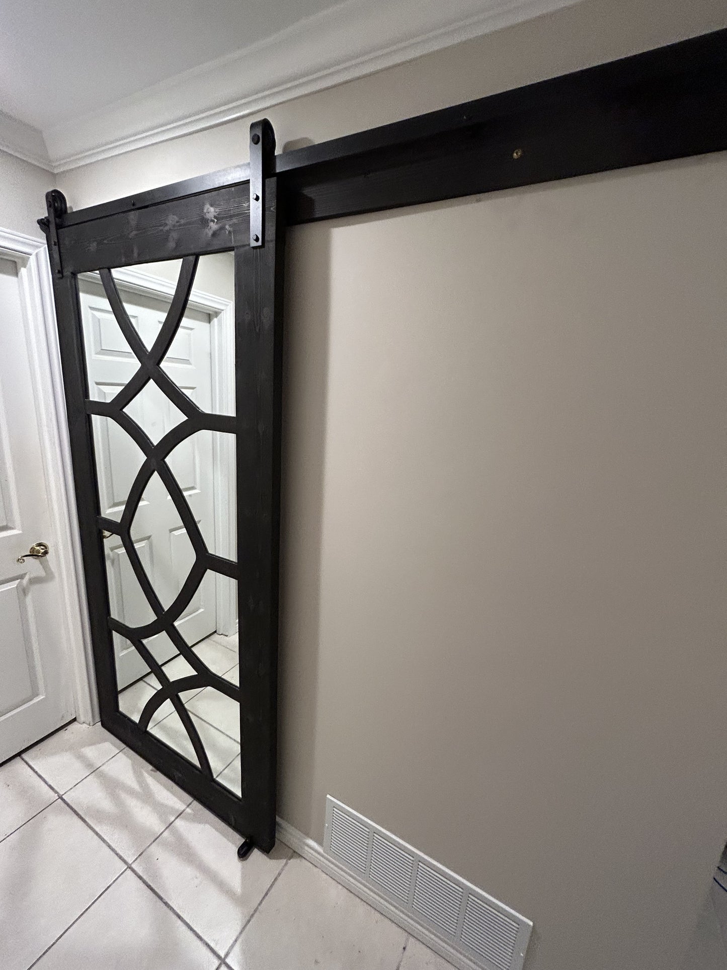 Decorative X-Brace Barn Door with Mirror Insert