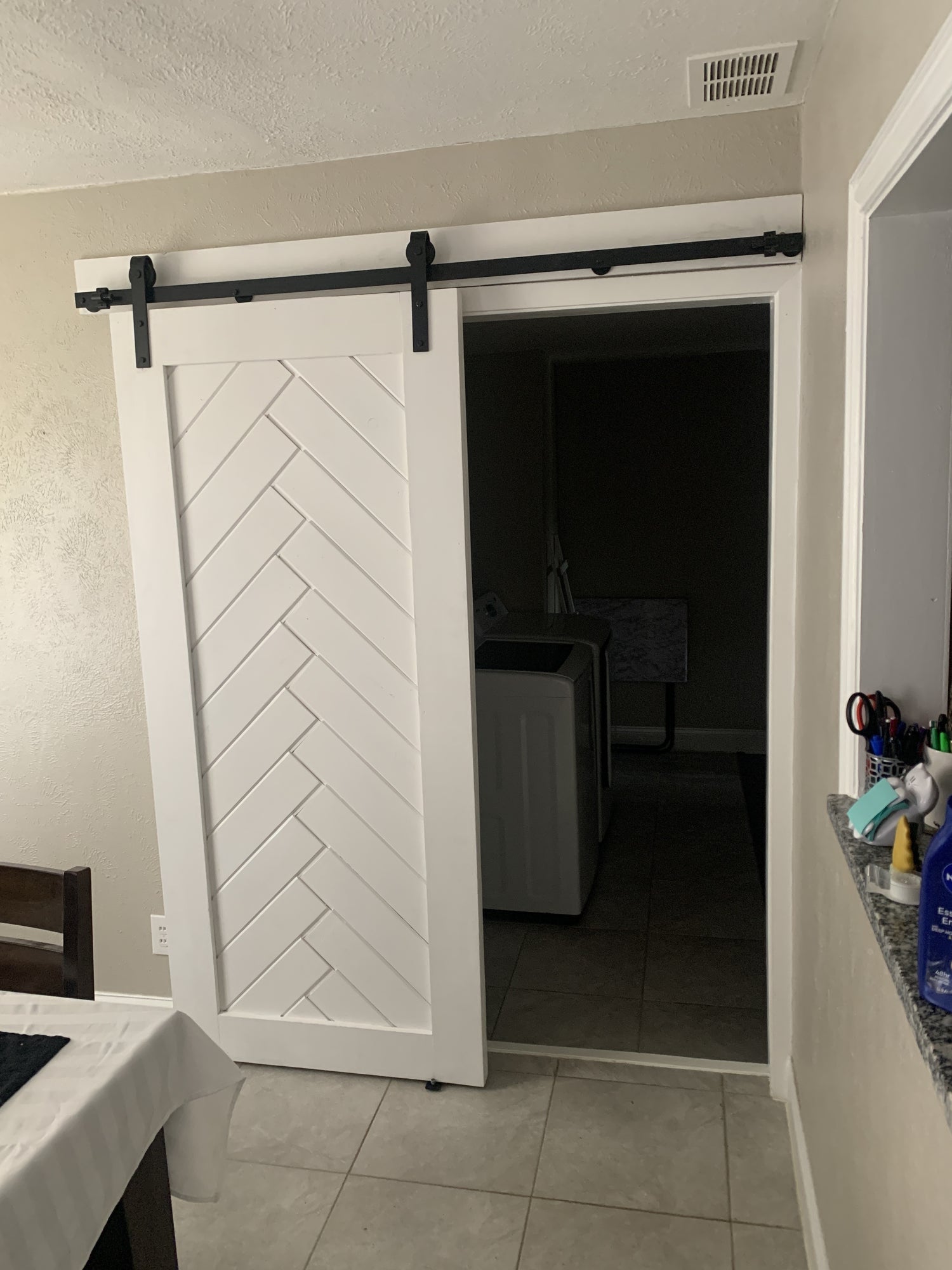 Chevron Pattern Sliding Barn Door with Black Hardware