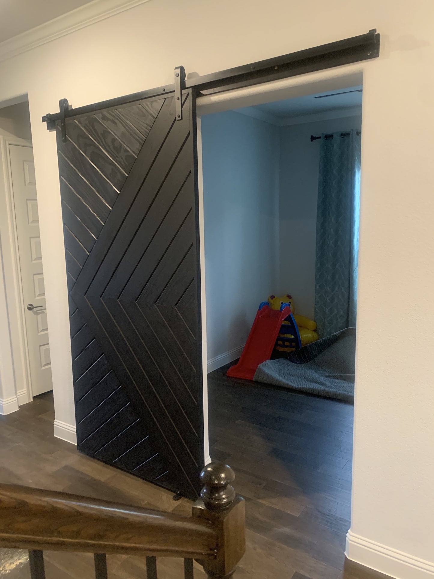 Chevron Pattern Barn Door with Black Hardware