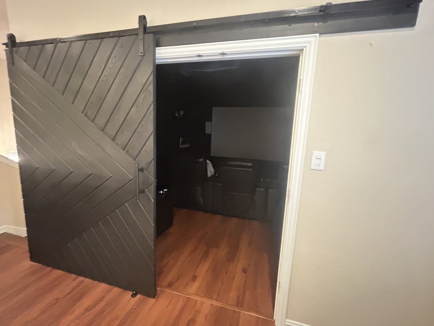 Chevron-Pattern Sliding Barn Door with Black Finish