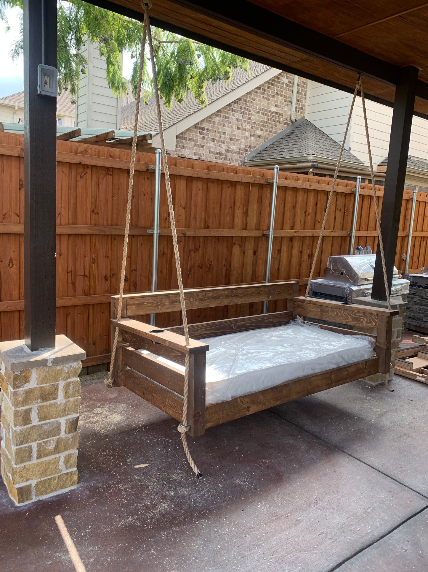 Twin size cedar porch swing bed with natural cedar finish and clear coat