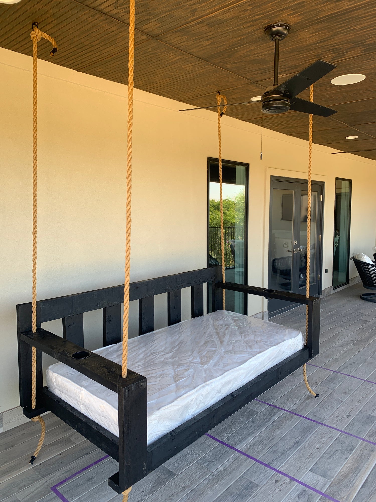 Twin size cedar porch swing bed with natural cedar finish and clear coat