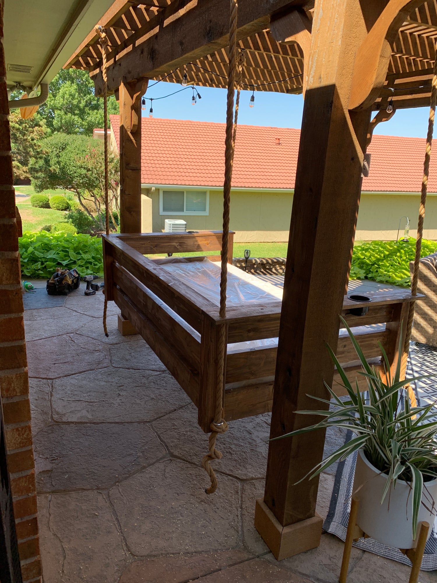 Twin size cedar porch swing bed with natural cedar finish and clear coat