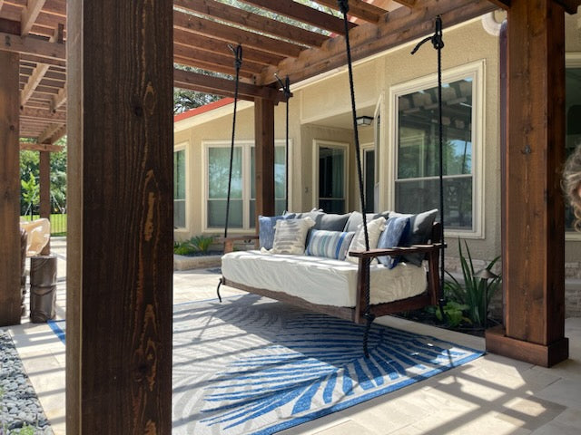 Doorplace USA porch swing installed on covered porch