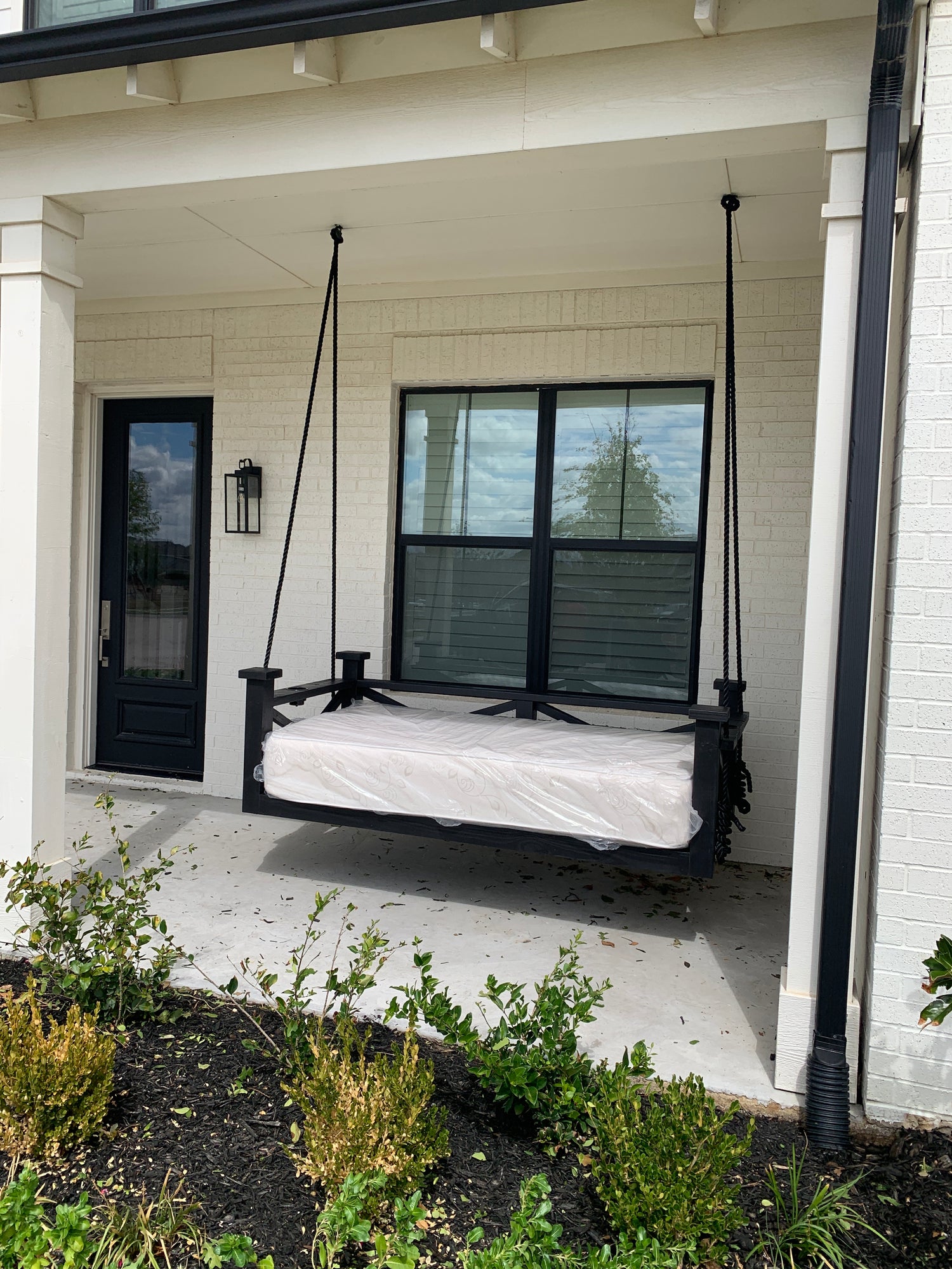 Twin size cedar porch swing bed with natural cedar finish and clear coat